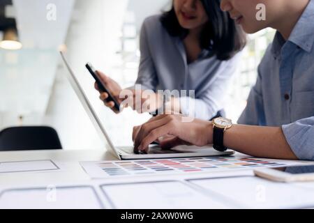 Programmer and UX UI designer working in a software development and coding technologies. Mobile and website design and programing development technolo Stock Photo