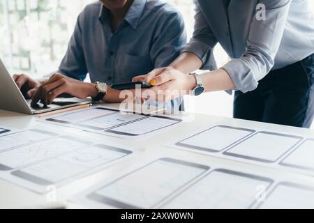 Programmer and UX UI designer working in a software development and coding technologies. Mobile and website design and programing development technolo Stock Photo