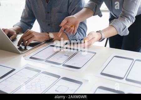 Programmer and UX UI designer working in a software development and coding technologies. Mobile and website design and programing development technolo Stock Photo