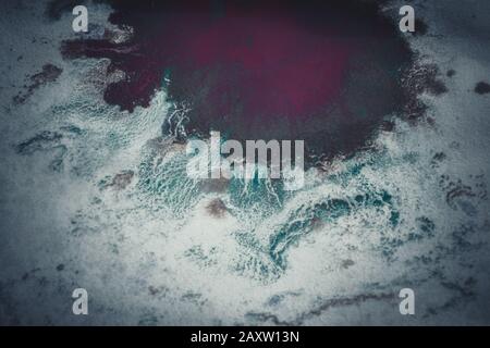 Multicolored paint stains, drips, splashes, mixing. Abstract colorful background Stock Photo