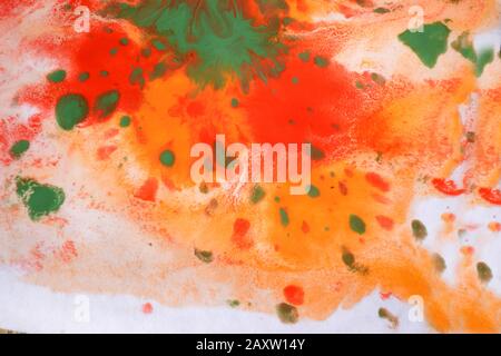 Orange, red, green, blots, splashes, drips, stains on a white background. Abstract pattern Stock Photo