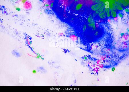 Abstract background of blots pink, green, and blue color with streaks and splashes on white paper Stock Photo