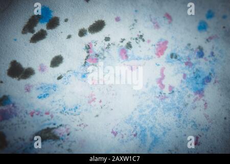 Multicolored paint stains, drips, splashes, mixing. Abstract colorful background Stock Photo