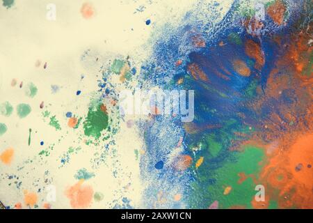 Multicolored paint stains, drips, splashes, mixing. Abstract colorful background Stock Photo