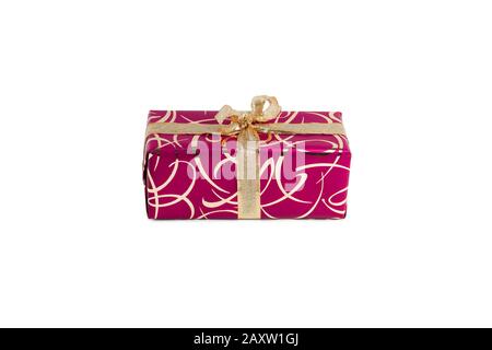packaged rectangular gift in dark pink packaging with gold bow and gold pattern on a white background Stock Photo