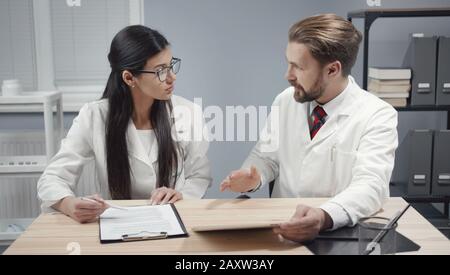 Doctors discussing working moments Stock Photo