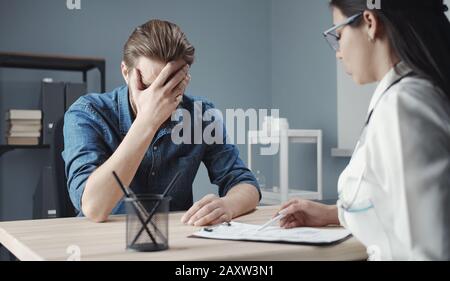 Doctor telling patient bad news Stock Photo