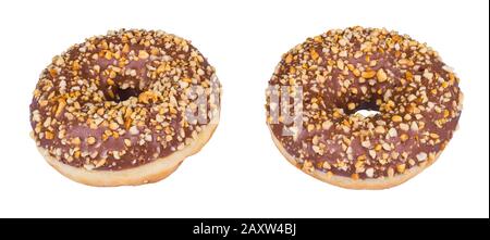 Two sweet chocolate glazed donuts sprinkled with nuts pieces isolated on a white background. Round doughnuts baked from yeast dough with nutty topping. Stock Photo
