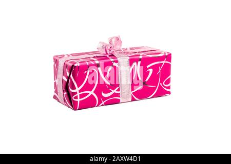 packaged rectangular gift in pink packaging with gold bow and gold pattern on a white background Stock Photo