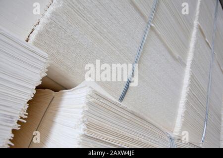 Recyled paper stacked in warehouse Stock Photo