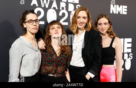 Juliette Jackson, Celia Archer, Fern Ford, and Soph Nathann of The Big Moon arriving during the NME Awards, held at Brixton Academy, London. Stock Photo