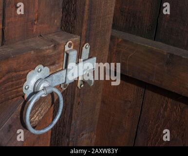 Ring handled gate latch in close up on a gate Stock Photo