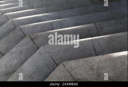 Empty stone stairs with bright sunlight pattern on it. Abstract architecture background photo Stock Photo