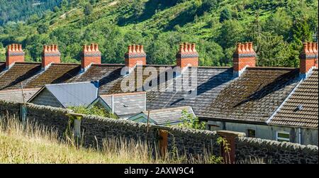 Row of red chimney pots on terraced houses in Clydach Vale, Rhondda, South Wales Stock Photo