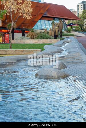 Waterline water sculpture by Jon Tarry sculptor at Yagan Square Perth CBD WA Australia. Stock Photo