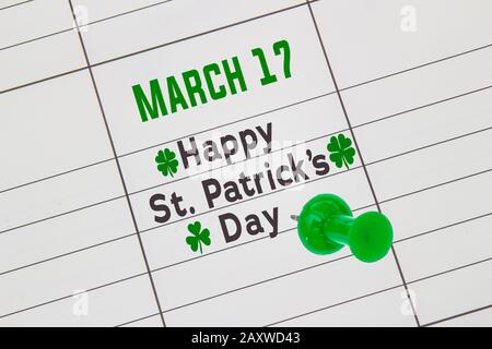 A close up of a calendar on March 17 with the text: Happy St. Patrick's Day Stock Photo