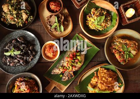 Minahasan Rijsttafel. An array of traditional dishes from Manado, Minahasa. Stock Photo