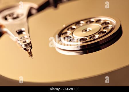 Disassembled hard drive from the computer, hdd with mirror effect. Opened hard drive from the computer hdd with mirror effects. Part of computer pc, l Stock Photo