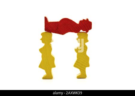 Two women figures carrying a man figure, concept, isolated on a white background Stock Photo