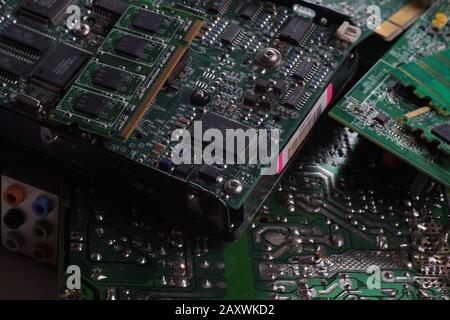 Electro garbage. Computer components including motherboards and RAM as a source of recovered precious raw materials. Stock Photo