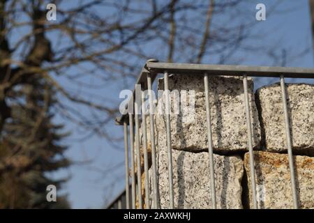 Gabion. Close-up on a steel, galvanized structure filled with spectacular pieces of rock. Stock Photo