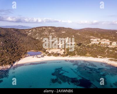 Aerial view of Spiaggia Bianca, White Beach in Golfo Aranci, blue water, amazing granite rocks and sandy beaches. North Sardinia in winter Stock Photo