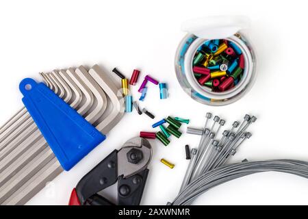 Tools for bicycle repair. On a white background. Inner gear cable, nippers, Hex Wrench-Allen Key. Bicycle service Stock Photo