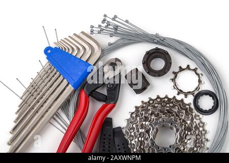 Tools for bicycle repair. On a white background. Inner gear cable, nippers, cassette. Bicycle service Stock Photo