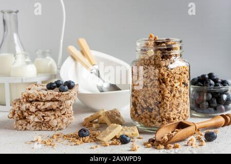 Homemade Ready breakfast granola, muesli with  fresh ripe blueberry, white chocolate and milk. Close-up, useful product, background Stock Photo