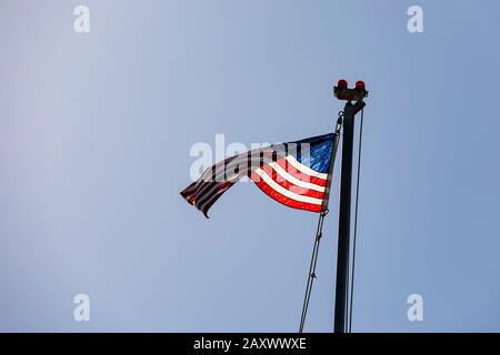 Stars and Stripes, the National flag flying over Santa Monica pier, California, United States of America. USA. October 2019 Stock Photo