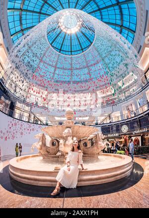 27 November 2019, UAE, Dubai: Panoramic view of the interior of the magnificent Emirates Mall, decorated for the celebration of national day Stock Photo