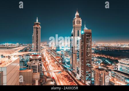 28 November 2019, UAE, Dubai: Night view of the spectacular landscape of Dubai with Al Yaqoub Tower at the Sheikh Zayed highway. Global travel destina Stock Photo