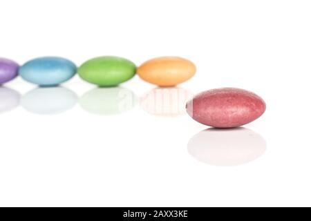 Group of five whole colourful hard candy isolated on black glass Stock ...