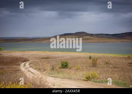 Wonderful view of artificial lake Serra del Corvo on a stormy day . Basilicata region, Italy Stock Photo