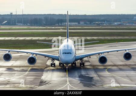 Huge wide-body aircraft on the steering track at the airport after arrival Stock Photo