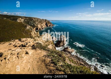 Cabo da Roca (is a cape which forms the westernmost point of the Sintra Mountain Range, of mainland Portugal, of continental Europe, Stock Photo