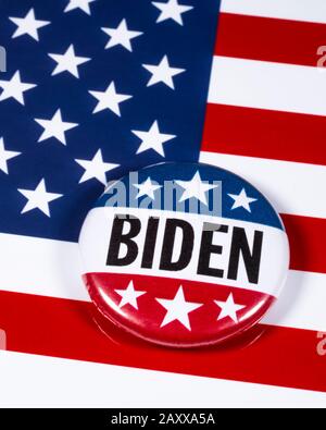 London, UK - February 10th 2020: A Joe Biden pin badge pictured over the USA flag symbolizing his campaign to become the next President of the United Stock Photo