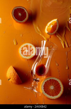 Cocktail 'Tequila sunrise' on a orange background. Top view. Stock Photo