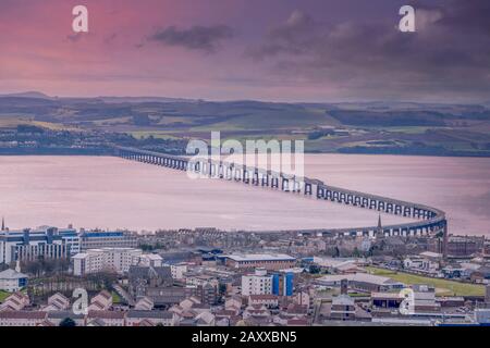 From the monument at Dundee law Hill looking down over the city to the Fourth or Tay Railway Bridge Dundee Scotland at sunset. Stock Photo