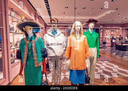 27 November 2019, UAE, Dubai: Gucci luxury fashion store showcase in Emirates Mall Stock Photo