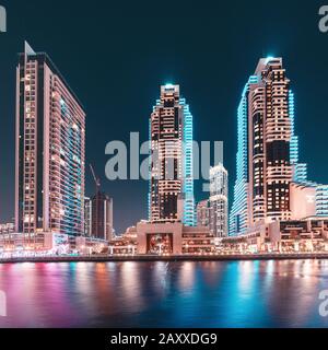 27 November 2019, United Arab Emirates, Dubai: Night view of illuminated skyscrapers and tower buildings of Grosvenor House Hotel in Dubai Marina Dist