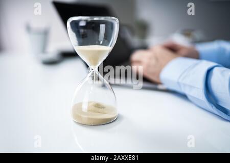 Man Working On Laptop Under Time Pressure Stock Photo