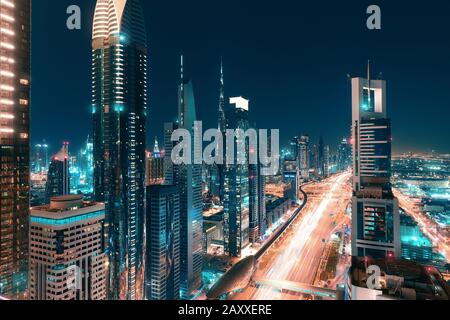 Night view of the spectacular landscape of Dubai with high-rises and skyscrapers at the Sheikh Zayed highway. Global travel destinations and real esta Stock Photo