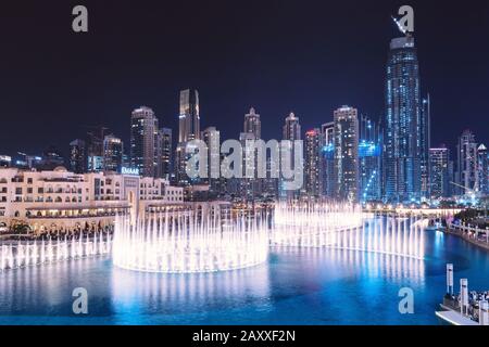 26 November 2019, UAE, Dubai: Amazing Show of dancing fountains in the pool near Burj Khalifa and Dubai Mall at night Stock Photo