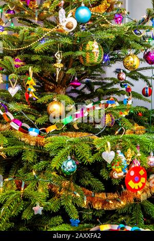 Colorful light green beautiful christmas tree hdr shot closeup abstract texture. Multiple home made shiny diy christmas traditional holiday decoration Stock Photo