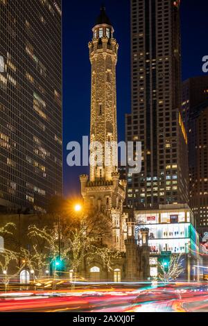 Old Water Tower and traffic on Michigan Avenue at night Stock Photo