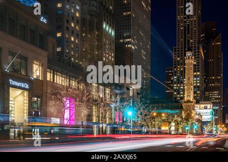 Old Water Tower and traffic on Michigan Avenue at night Stock Photo