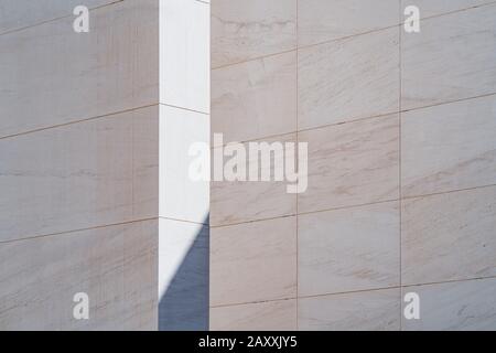 Light and shadow between white limestone walls Stock Photo