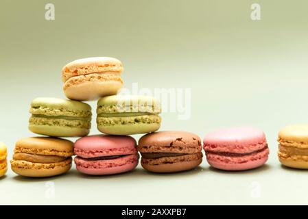 Front view of colorful macaroons on a marble countertop Stock Photo