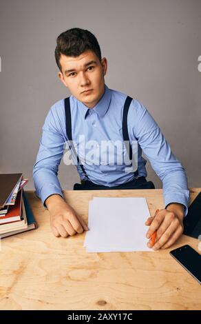 young man in the workplace thinking about something Stock Photo